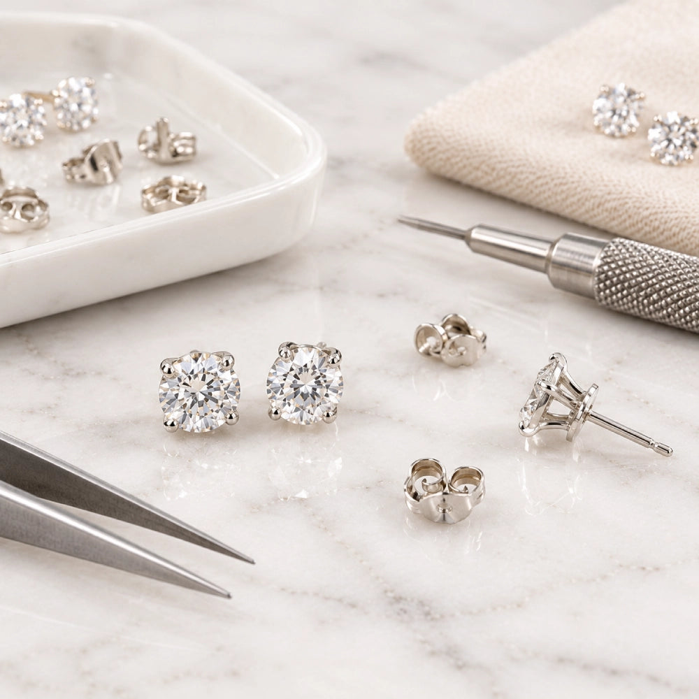 Jeweller carefully setting a diamond in a gold ring